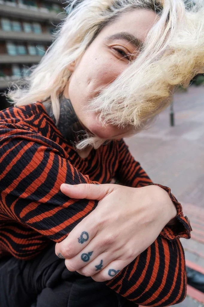 Half covered by hair pose: Letting your hair fall or blow across half your face, rather than pushing it away, adds mystery and movement that a fully visible face doesn't give you.