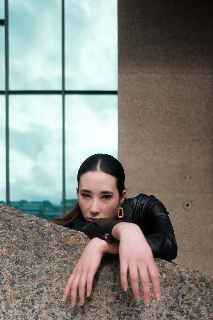 Leaning and hanging over a ledge