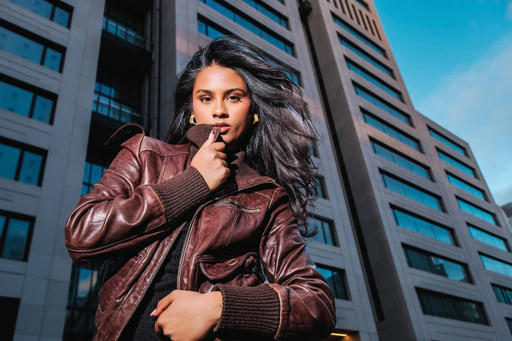 Grabbing at own clothing to shift the body